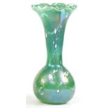 A John Ditchfield glass vase with flared rim,