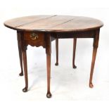 A George II walnut drop-leaf supper table with oval top, with single frieze drawer,