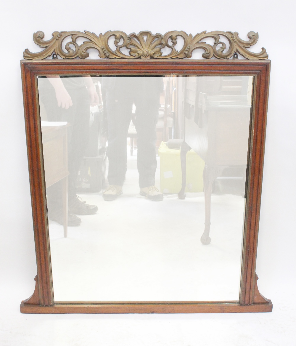 A 19th century mahogany framed overmantel mirror with metal foliate scrolling pediment,