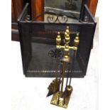 A folding metal fire screen and a brass four-piece companion set on stand (2).