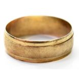 A hallmarked 9ct gold wide band ring, size V, approx 3g.