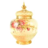 A Royal Worcester blush ware covered potpourri vase of globular form,