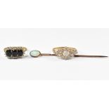 A 9ct yellow gold ring marquise set with white stones, a yellow metal stick pin with an oval opal,