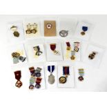 A quantity of Masonic medals, mainly enamelled and on ribbons,