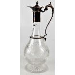 An Elizabeth II etched glass claret jug with hallmarked silver handle and cover,