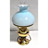 A brass oil lamp with opaque blue glass shade, converted to electricity and a modern lava lamp (2).