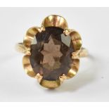 A 9ct yellow gold ladies' dress ring set with oval smoky quartz stone, size K, approx 3g.