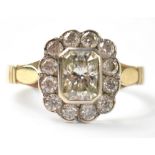 A 9ct gold diamond ring, a central bezel set cushion cut stone approx 0.75ct, approx 6.5 x 4.