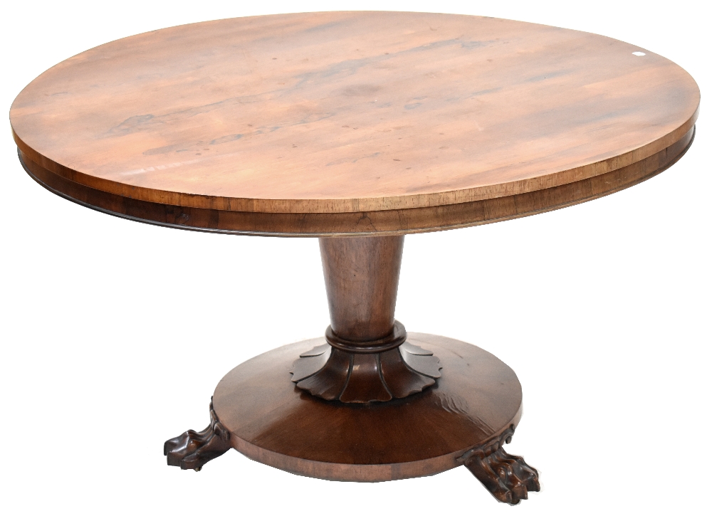 A Regency rosewood circular tilt-top breakfast table on a turned and tapering column with lobed