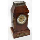 A Victorian burr walnut mantel clock with brass cast fittings,