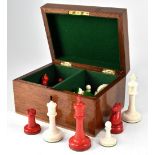 A boxed set of stained ivory chessmen. CONDITION REPORT Height of king 10cm.