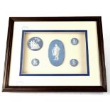 Five light blue jasper ware roundels with Classical maiden decoration, 17 x 25cm, framed and glazed.