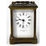 Sam Robbins Ltd, Paris; a brass carriage clock, the white dial set with Roman numerals, height 11cm.