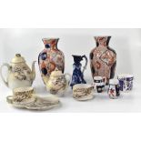 A Japanese eggshell part tea set decorated with birds in prunus tree, a pair of Imari vases, etc.