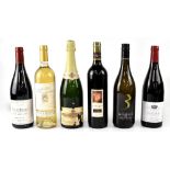 Six bottles of red and white wine, a 2014 Fleurie, a 2010 Côte de Brouilly,