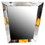 A large rectangular bevelled glass wall mirror with bevelled glass frame, 87 x 117cm.