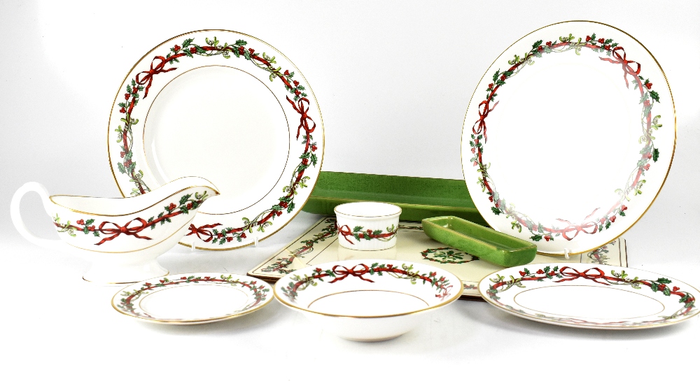 A Royal Worcester part dinner service 'Holly Ribbons', comprising eight dinner plates,