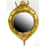 A 19th century Regency-style circular convex gilt framed wall mirror surmounted with a Hoho bird