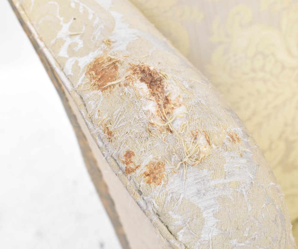 A 19th century mahogany wing back armchair upholstered in a cream sateen fabric, - Image 6 of 6