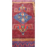 An antique Persian handmade Kurdish rug, 185 x 137cm.