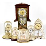 A group of various clocks to include a Metamec mahogany cased mantel clock,