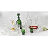 A quantity of cut and moulded glassware to include a Victorian green glass and silver decorated