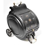 A Victorian metal barrel-form coal scuttle with applied military badges,