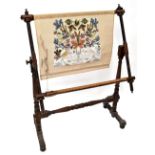 A Victorian mahogany needlework stretcher with turned supports and baluster uprights united by a