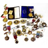 A quantity of Masonic medals, some enamelled and some with ribbons, two in original boxes,