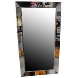 A large rectangular bevelled glass wall mirror with bevelled glass frame, 106 x 191cm.