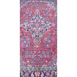 A fine Persian hand made red ground Luri rug, 210 x 137cm.