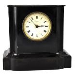 An early 20th century Collet ebonised mantel clock, the white dial set with Roman numerals,