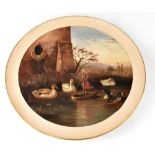 A modern pottery charger hand painted with a scene of ducks surrounding a model boat fashioned from