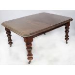 A 19th century mahogany wind-out dining table with rounded corners,