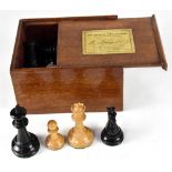 A boxed set of Jaques Staunton chessmen with red crown marks.