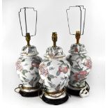 Three table lamps of baluster form with raised peony and floral decoration in the Chinoiserie style,