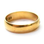 A 18ct gold band ring, size N, approx 3.9g.