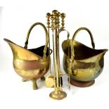 Two near-matching brass coal scuttles and a brass fire companion set with stand, brush, shovel, etc.