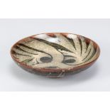 CHARLES VYSE (1882-1971); a stoneware footed dish with floral decoration, incised signature and