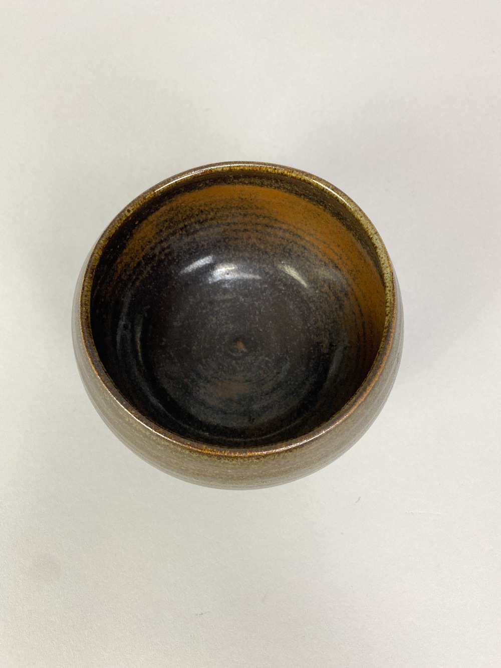 PAUL BARRON (1917-1983); a stoneware chawan covered in tenmoku and mottled green glaze, impressed - Image 3 of 5