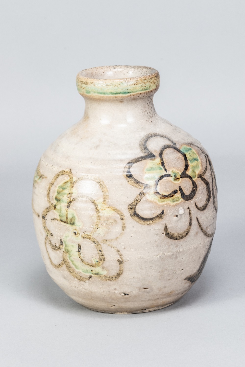 REGINALD MARLOW; a stoneware bottle with iron and copper floral decoration on mottled pale grey