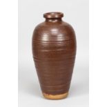WILLIAM STAITE MURRAY (1881-1962); a tall stoneware bottle covered in iron rich glaze, impressed M