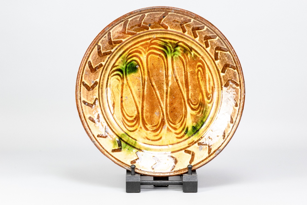 MICHAEL CARDEW (1901-1983) for Winchcombe Pottery; a slipware charger with meander and chevon