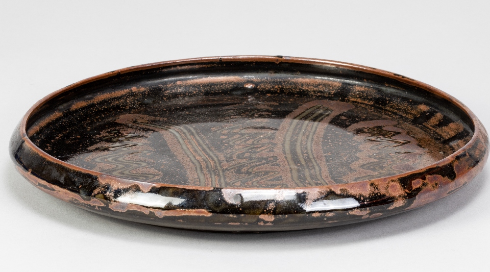 BAWA USHAFA for Abuja Pottery; a large stoneware platter with wax resist decoration on tenmoku - Image 2 of 4