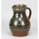 PAUL BARRON (1917-1983); a stoneware jug with wax resist decoration on iron rich ground, impressed B