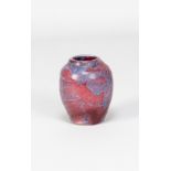 REGINALD FAIRFAX WELLS (1877-1951); a small stoneware vase covered in red and mottled blue glaze,