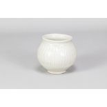 BERNARD LEACH (1887-1979) for Leach Pottery; a fluted porcelain pot covered in celadon glaze,