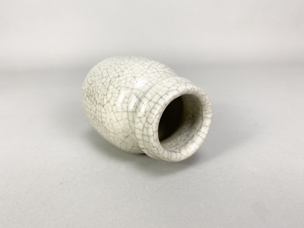 CONSTANCE DUNN; a small stoneware vase covered in white crackle glaze, impressed W mark, made - Image 3 of 5