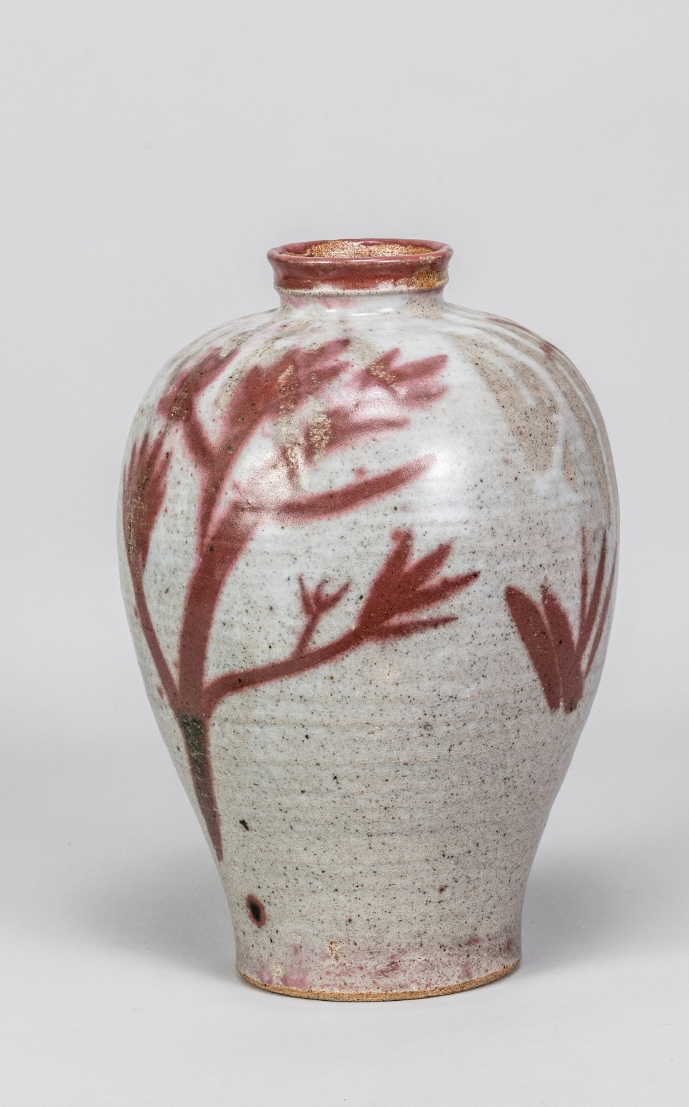 PHILIP WADSWORTH (1910-1991); a large stoneware bottle with red and green copper floral decoration