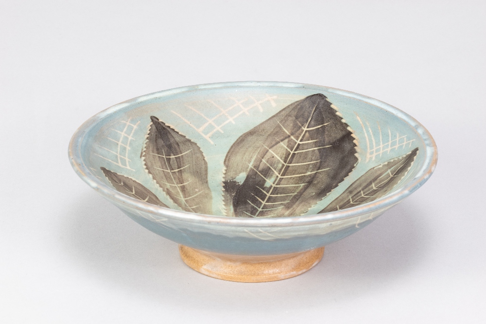 SYBIL FINNEMORE for Yellowsands Pottery; a stoneware footed dish with incised and painted leaf